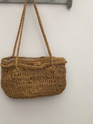Knitted bag like new with golden yarn and fabric lining