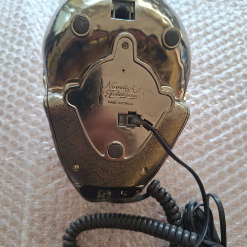 Decorative skull-shaped phone used, wired
