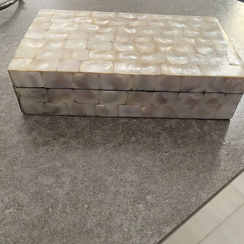 Box with glossy beige-white texture