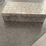 Box with glossy beige-white texture