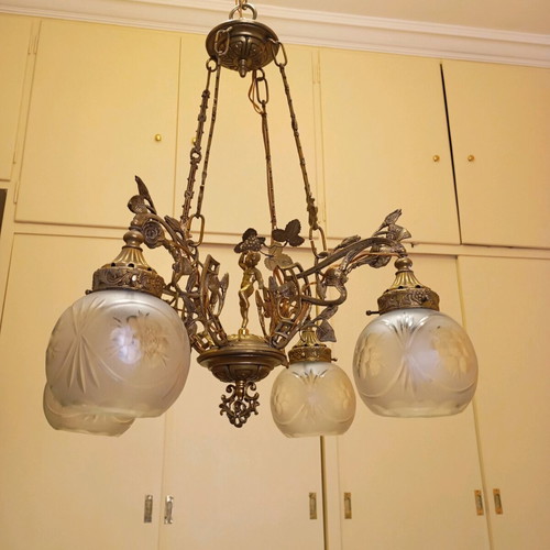 Solid brass chandelier used with crystals and putto figurine