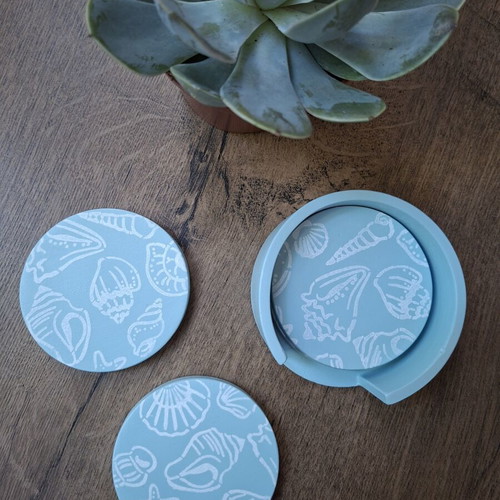 Handmade plaster coaster set with summer decoration and soft blue color