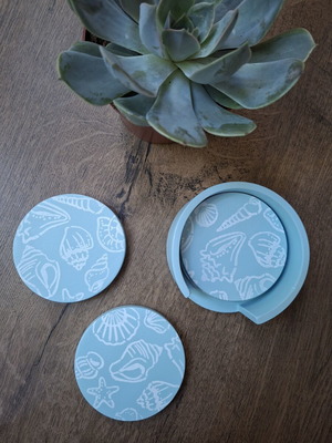 Handmade plaster coaster set with summer decoration and soft blue color
