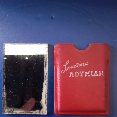 Two-sided mirror used with Papagalos coffee logo