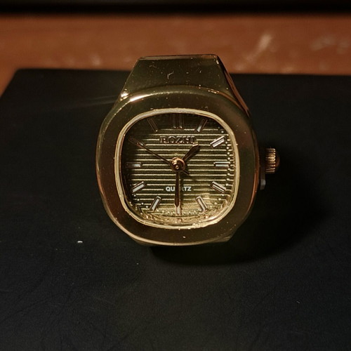 Ring watch with khaki dial and gold bracelet