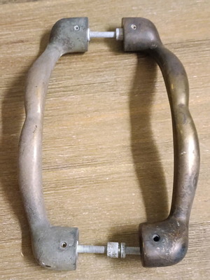 Pair of vintage brass door handles 1950 with natural patina used