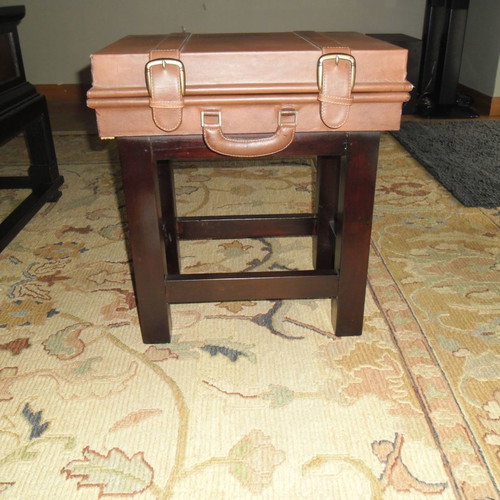 Leather folding table used with suitcase-shaped storage space