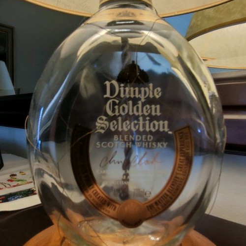Dimple Golden Selection lamp used with handmade papyrus shade and wooden base