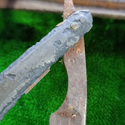 Vintage straight razors with leather strop and wooden handle
