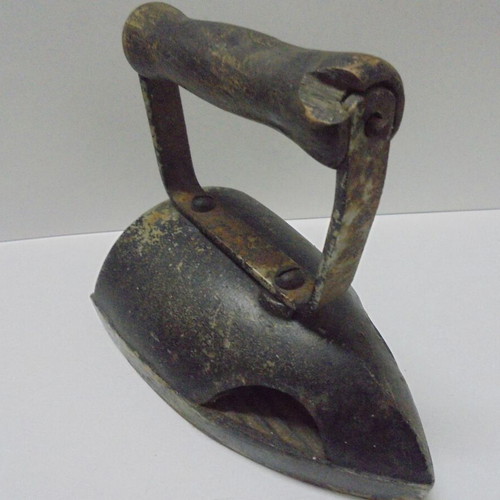 Old cast iron iron with internal heating plate used