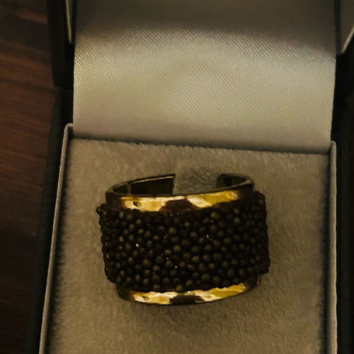 Steel ring gold plated with embossed brown designs like new, adjustable