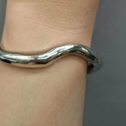 Silver metal cuff bracelet with minimal wave design