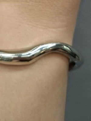 Silver metal cuff bracelet with minimal wave design
