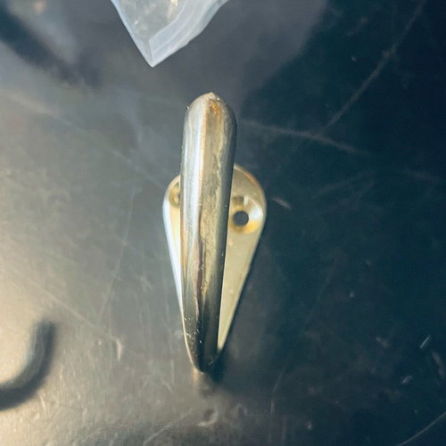 Double and single gold-coloured wall hooks