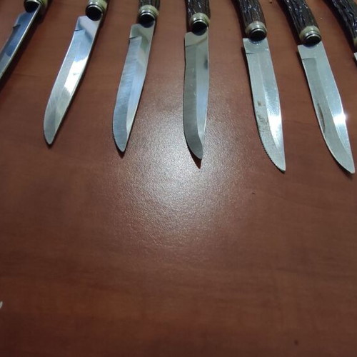 Vintage steak knives set of 9 with faux antler handles like new