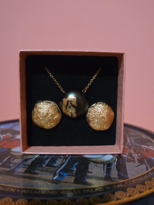 Steel jewelry set new with gold and black necklace and gold earring