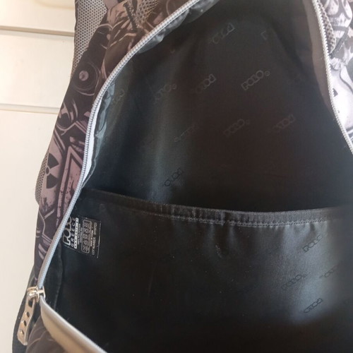 Polo character school backpack with multiple compartments