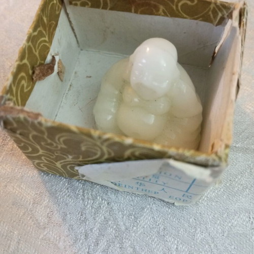 Alabaster-style miniature Buddha, smiling