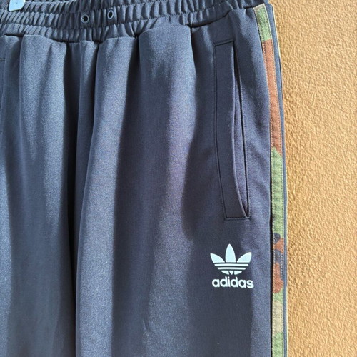 Adidas Originals women's black sweatpants with camouflage stripes like new