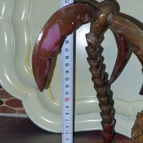 Decorative item used with camels and palm tree made of wood and plastic