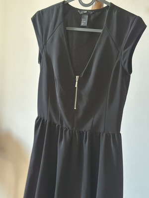 Mini black dress used with light neckline by H&M