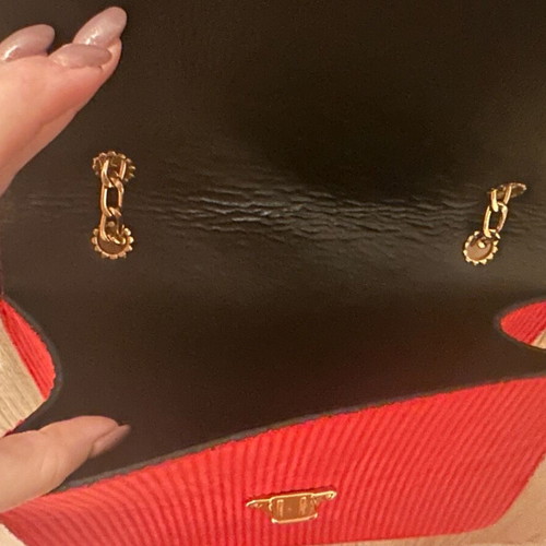 Red crossbody bag with gold details and chain new