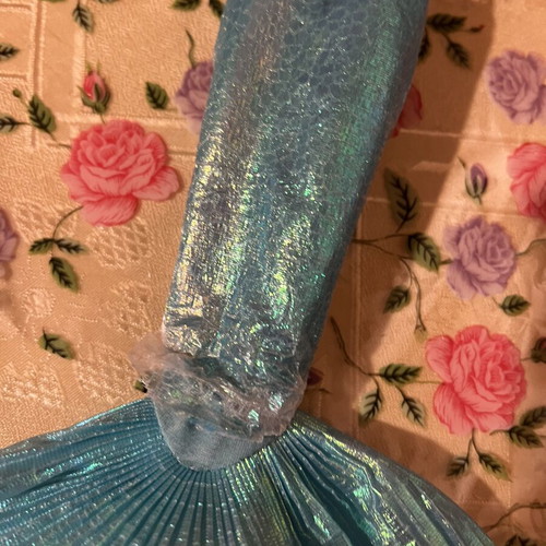 Mermaid doll with clothes used, damaged doll and worn clothes