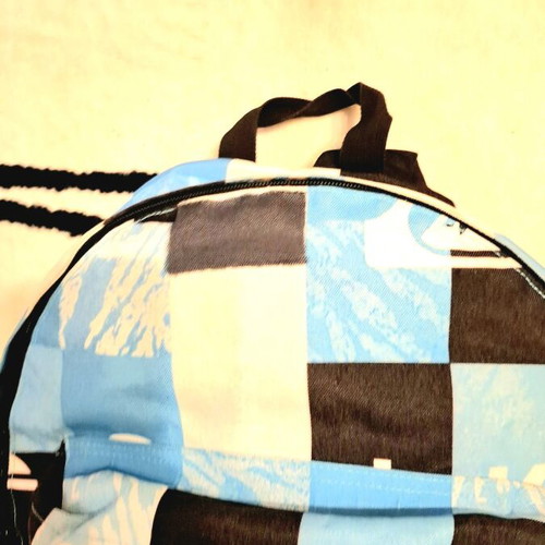 Collectible Quicksilver blue checkered school bag, with slight wear on the front pocket. Unique