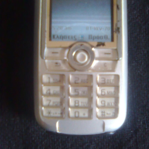 Sony Ericsson K700i used mobile phone with charger and headphones