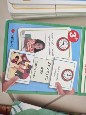Board game set cards learn the time Greek and English used