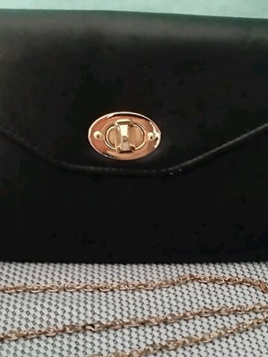 Black envelope evening bag like new with gold detachable chain