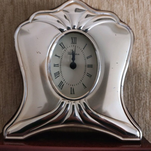 Silver table clock used with rosewood base