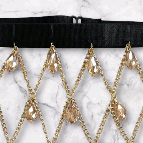 Garter new with gold chains and large crystals