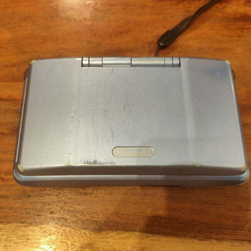 Nintendo DS console with charger and stylus