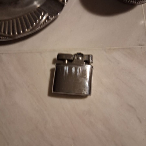Plastic ashtray with lighter base