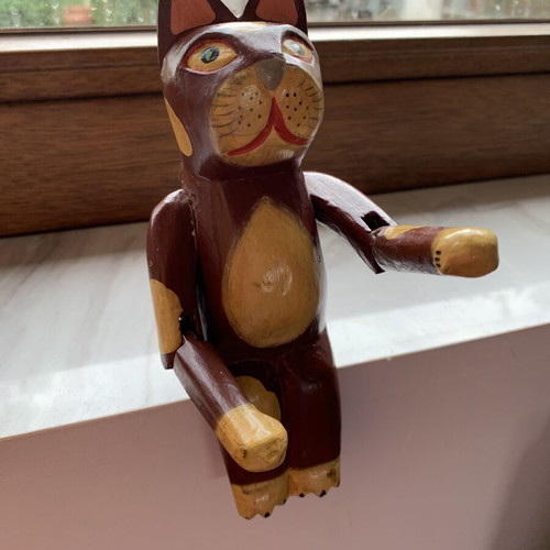 Wooden sitting cat with movable arms, like new, ~20 cm