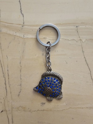 Keychain used, fish design with blue stones