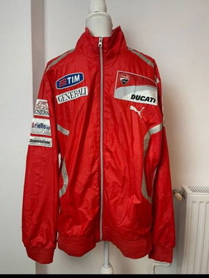 Ducati team jacket used, moderate condition with holes and stains
