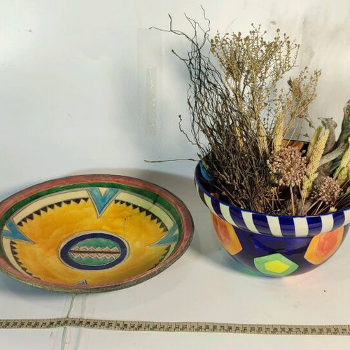 Mexican style ceramic plate and vase with plant composition used