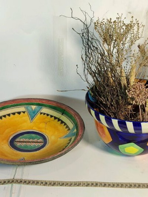 Mexican style ceramic plate and vase with plant composition used