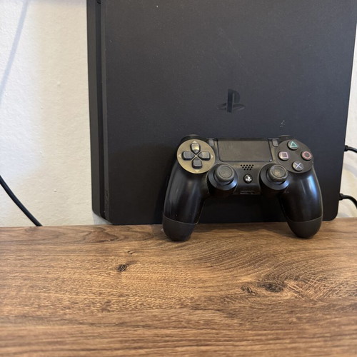 Sony PlayStation 4 console with one controller