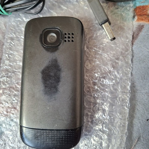 Nokia C2-05 phone with charger, headphones and data cable