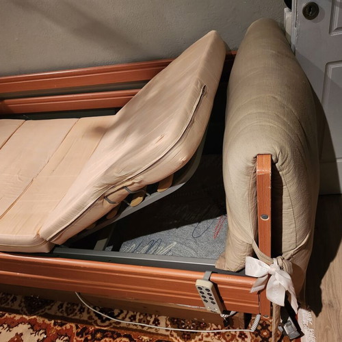 Electric hospital bed used with headboard