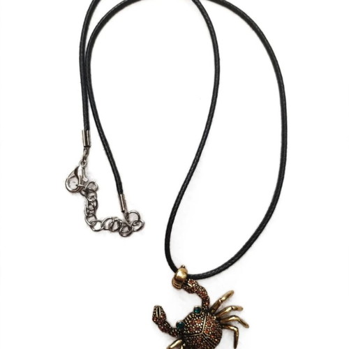 Crab pendant like new, dark gold with stones