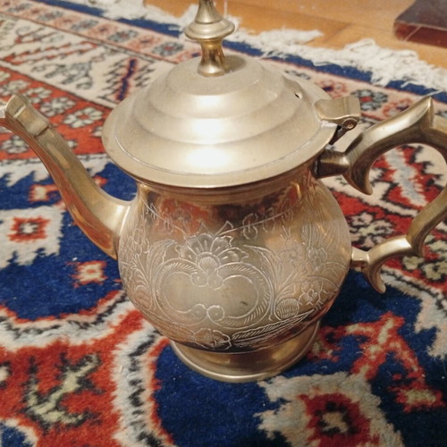 Vintage handmade oriental brass teapot with floral engravings