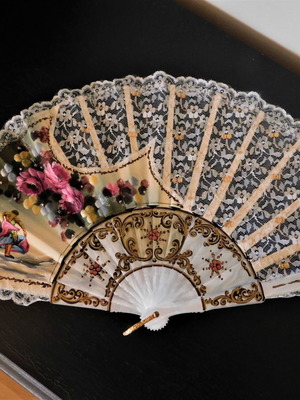 Vintage fan with painting used