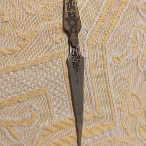 Vintage metal sewing stiletto with Art Nouveau motifs