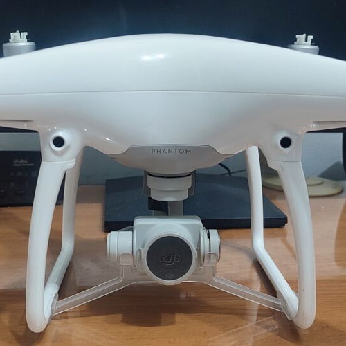 DJI Phantom 4 drone with accessories (no working batteries)