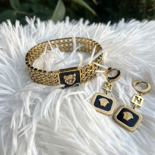 Princess stainless steel bracelet and earrings set like new, black and gold
