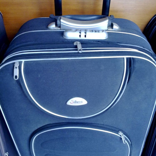 Wheeled travel suitcases, black and grey, like new